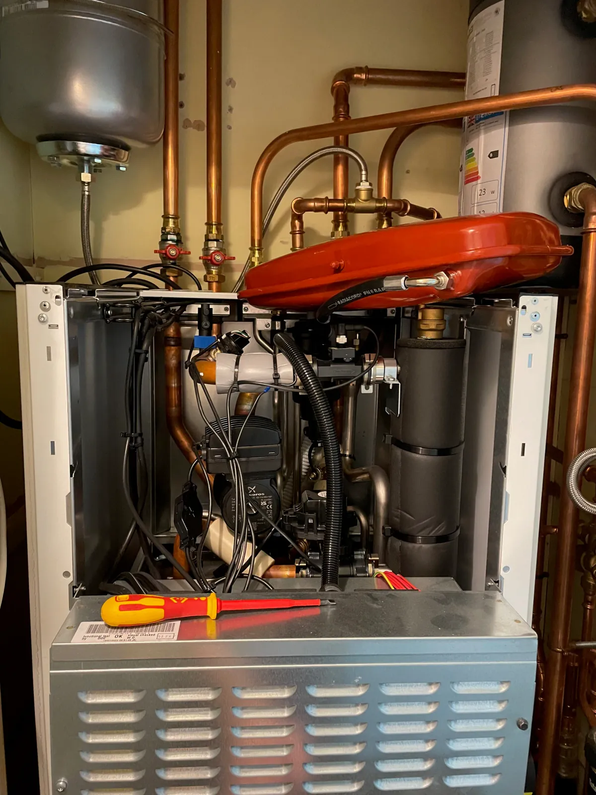 Internal heat pump components inspected during a service
